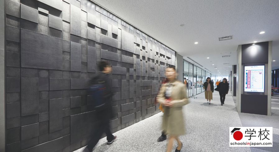 students walking in a hallway at Hosei University