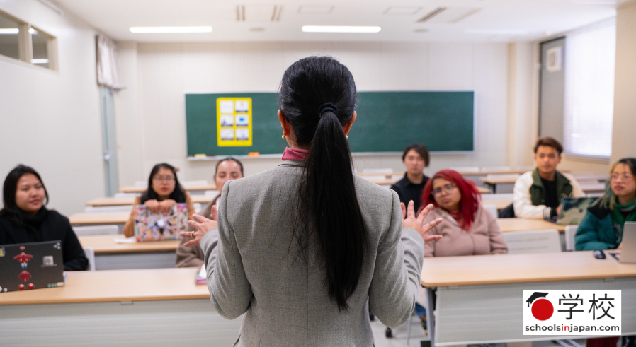professor teaching a group of university students in a classroom